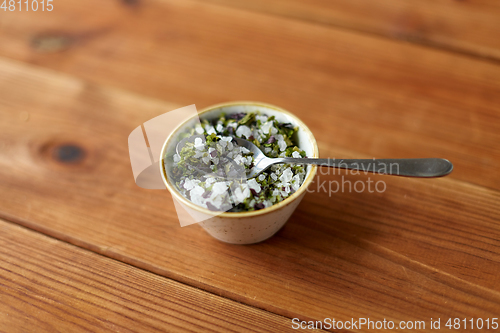 Image of close up of flavored sea salt in bowl with spoon