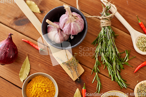 Image of spices, onion, garlic and red hot chili peppers
