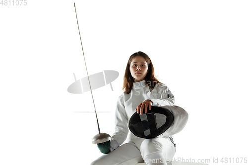 Image of Teen girl in fencing costume with sword in hand isolated on white background