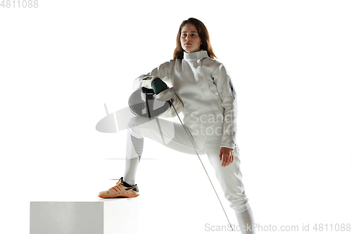 Image of Teen girl in fencing costume with sword in hand isolated on white background