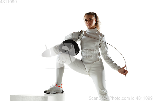 Image of Teen girl in fencing costume with sword in hand isolated on white background