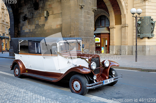 Image of Famous historic red car Praga in Prague street