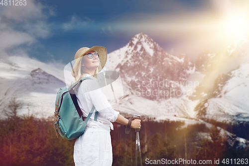 Image of young woman with nordic walk pols