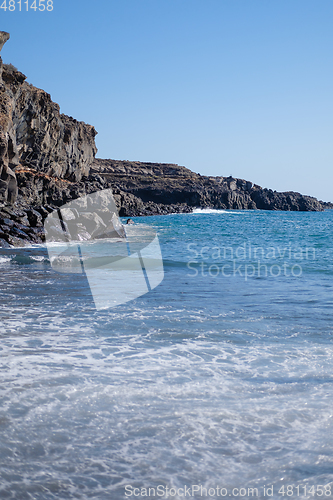 Image of beautiful wild beach with black sand