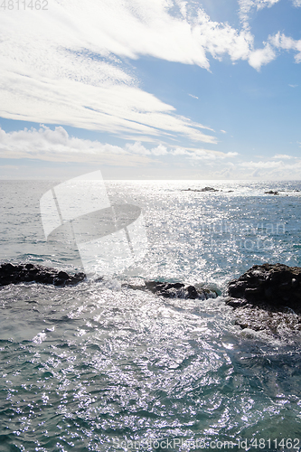 Image of beautiful wild beach with black sand