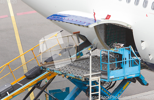 Image of AMSTERDAM, NETHERLANDS - JUNE 29, 2017: Loading luggage in airpl