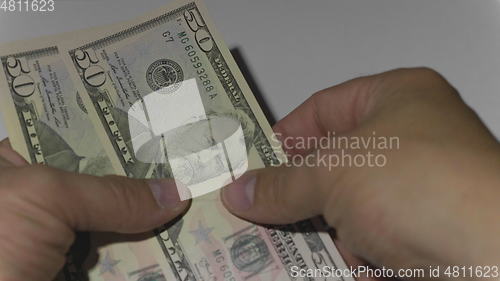 Image of Man counting money of one thousand US dollars. UltraHD stock footage