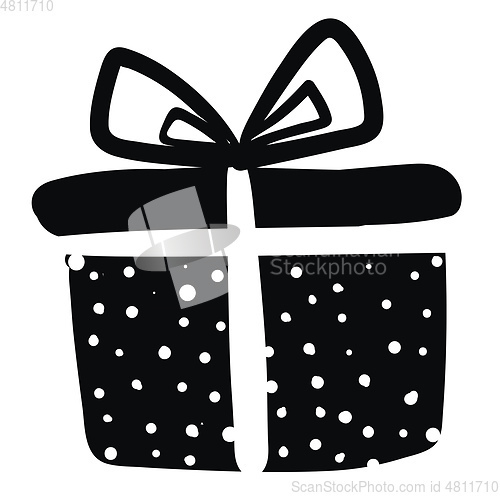 Image of A beautiful black and white polka dot paper wrapped present box 