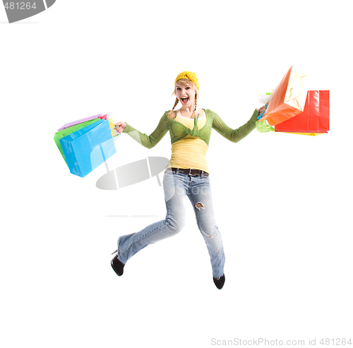 Image of Happy caucasian girl jumping with shopping bags