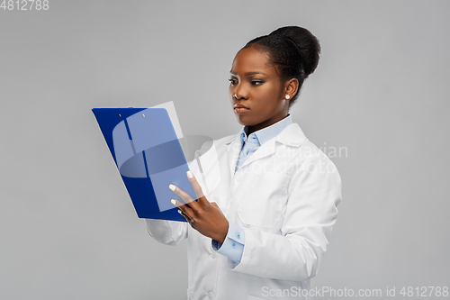 Image of african american female doctor with clipboard