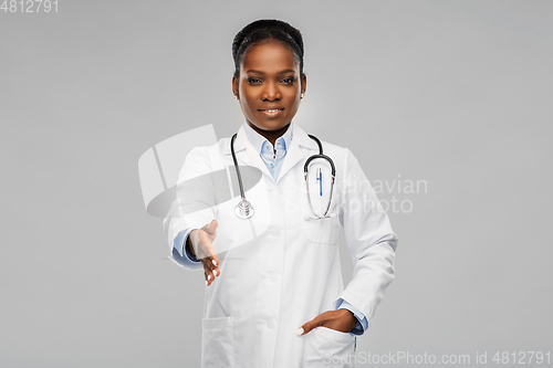 Image of african american female doctor making handshake