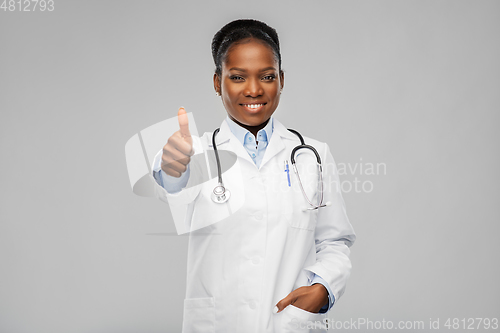 Image of african american female doctor showing thumbs up