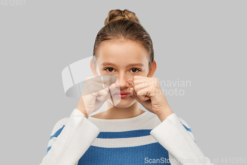 Image of crying teenage girl in pullover