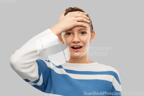 Image of surprised teenage girl in pullover