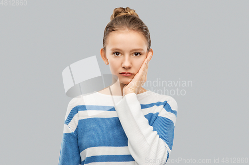 Image of teenage girl in pullover