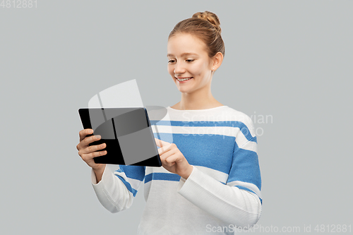 Image of happy smiling teenage girl using tablet computer