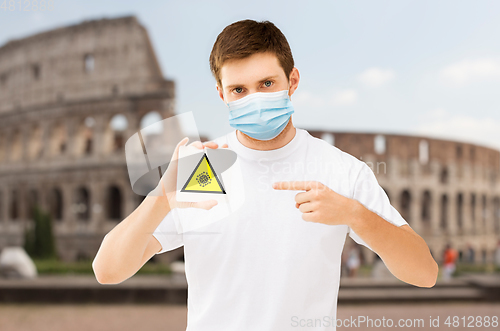 Image of man in medical mask with coronavirus sign in italy