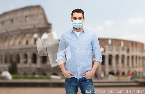 Image of man wearing protective medical mask in italy