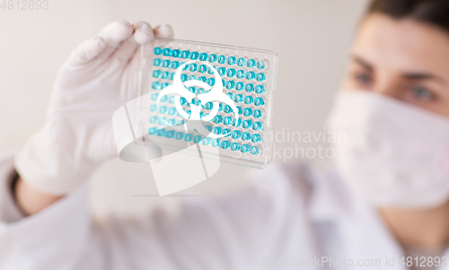 Image of scientist making biohazard test in laboratory