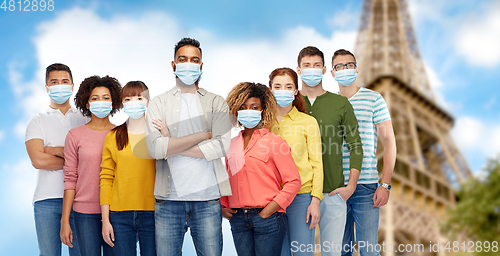 Image of people wearing protective medical masks in france