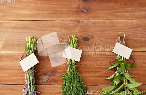 Image of lavender, dill and peppermint on wooden background