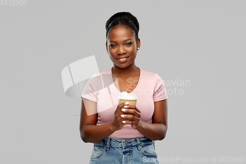 Image of happy african american woman drinking coffee