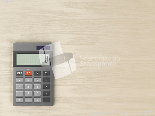 Image of Calculator on wooden desk