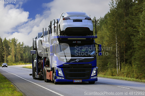 Image of Blue Volvo FM Car Transporter Hauls New Cars