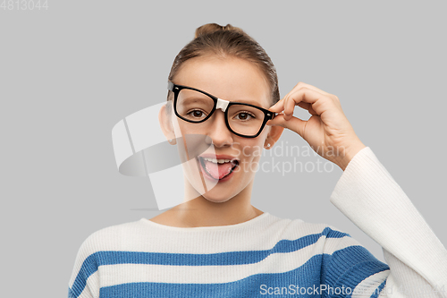 Image of funny teenage student girl in glasses