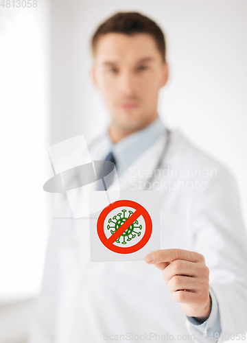 Image of male doctor holding coronavirus sign