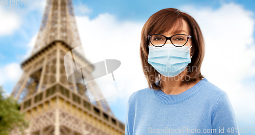 Image of senior woman in protective medical mask in france