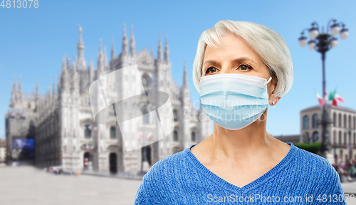 Image of senior woman in protective medical mask in italy