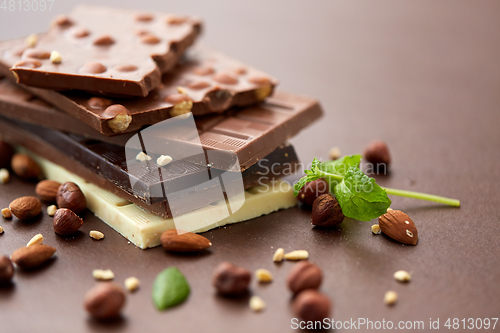 Image of close up of different chocolate bars and nuts