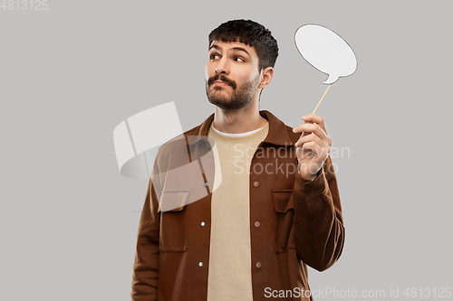 Image of young man with speech bubble over grey background