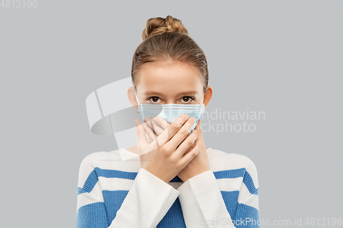 Image of teenage girl in protective medical mask