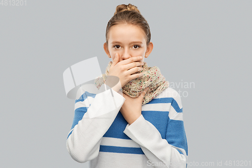 Image of sick coughing teenage girl in scarf