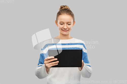 Image of happy smiling teenage girl using tablet computer