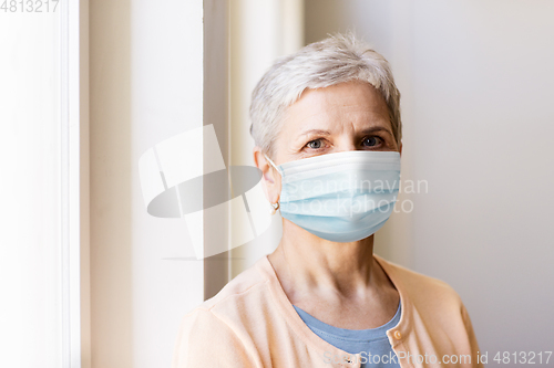 Image of senior woman in protective medical mask