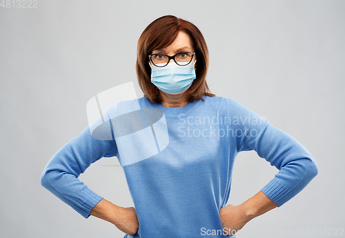 Image of senior woman in protective medical mask