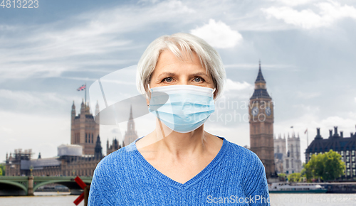 Image of senior woman in protective medical mask in england