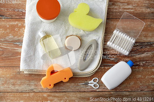 Image of baby accessories for bathing on wooden table