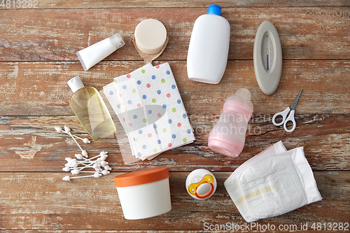 Image of baby accessories for bathing on wooden table