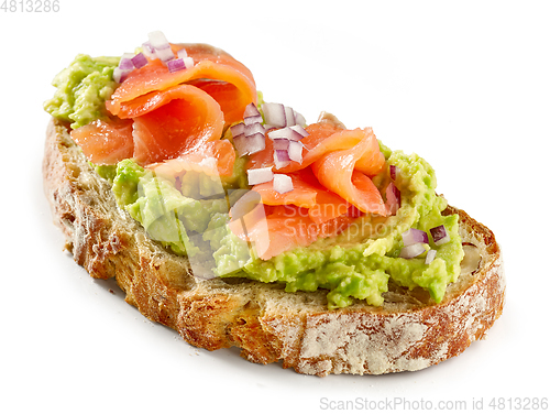 Image of slice of bread with avocado and salmon