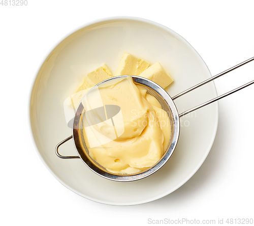 Image of custard cream in a strainer