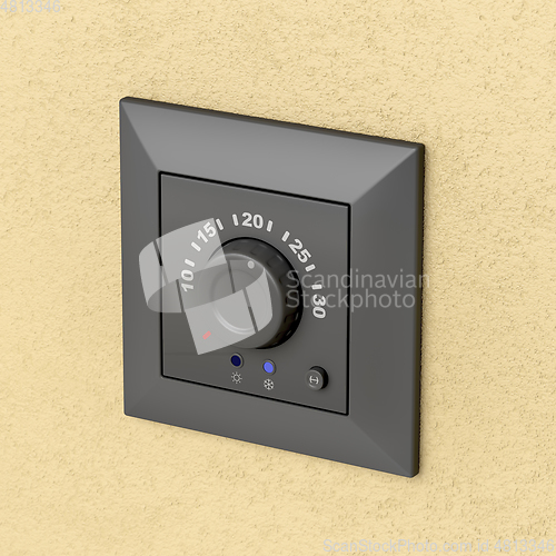 Image of Black analog thermostat