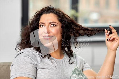 Image of portrait of happy young woman at home