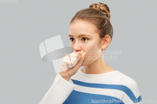 Image of sick coughing teenage girl in pullover