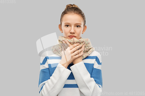 Image of sick teenage girl in scarf over grey background