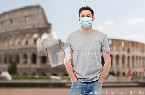 Image of man wearing protective medical mask in italy