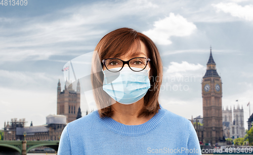 Image of senior woman in protective medical mask in england